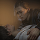 Amicia comforts Hugo in A Plague Tale: Requiem.